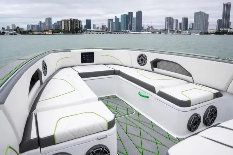 Slide: The Image of 2024 Deep Impact 399 Sport boat interior with city skyline in background. - 8
