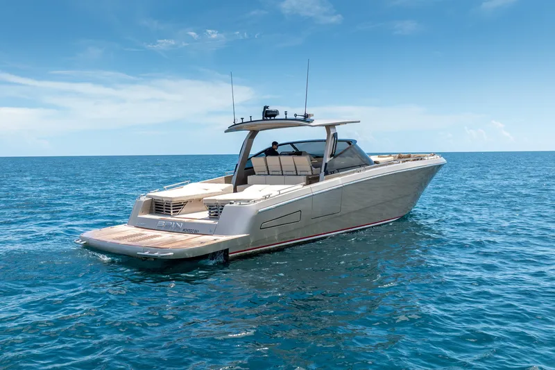 Slide: The Image of Luxurious 2019 CNM Continental 54 yacht cruising on open blue sea. - 11