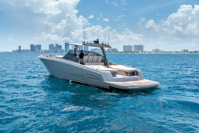 Slide: The Image of Luxury CNM Continental 54 yacht cruising near city skyline, 2019 model. - 13