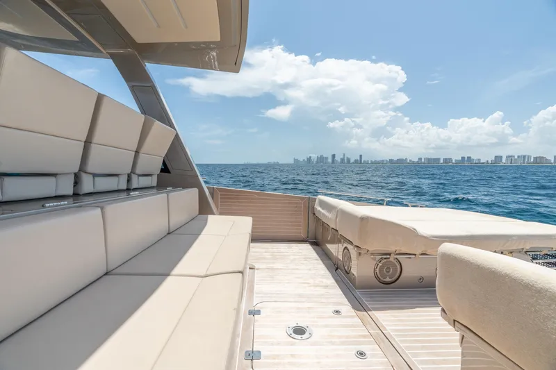 Slide: The Image of Luxurious 2019 CNM Continental 54 yacht with spacious deck, ocean view, and city skyline. - 17