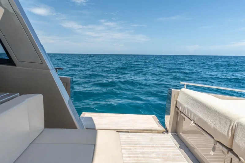 Slide: The Image of Luxury yacht CNM Continental 54, 2019 model, with ocean view and sunny deck. - 18