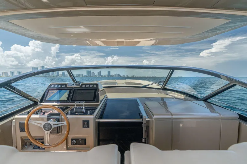 Slide: The Image of Helm of 2019 CNM Continental 54 yacht with city skyline view. - 2