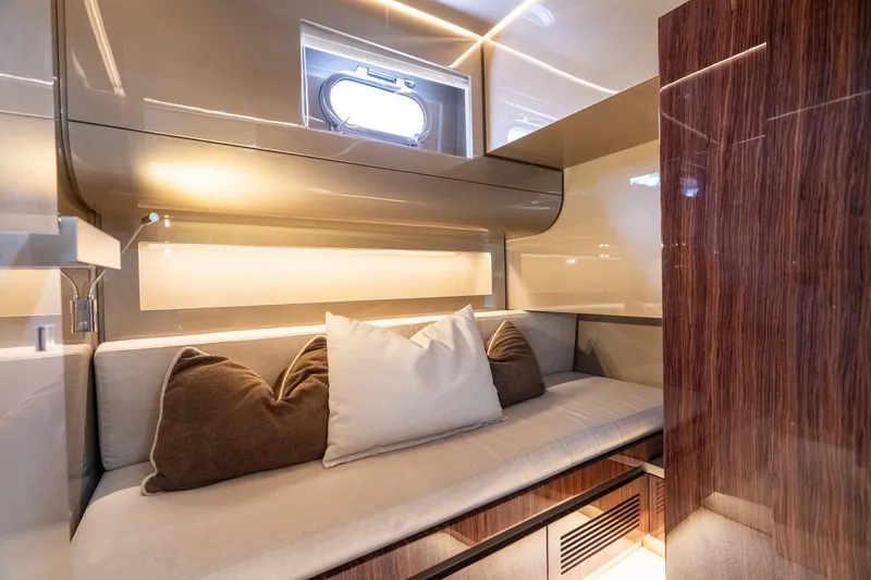 Slide: The Image of Luxurious interior of 2019 CNM Continental 54 yacht with elegant seating and cushions. - 29