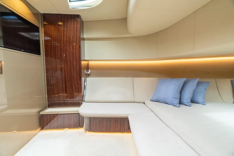 Slide: The Image of Luxurious interior of 2019 CNM Continental 54 yacht with elegant seating and ambient lighting. - 32