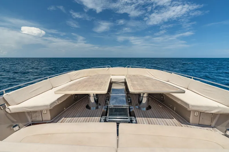 Slide: The Image of Luxurious CNM Continental 54 yacht deck with seating and tables, 2019 model, ocean view. - 39