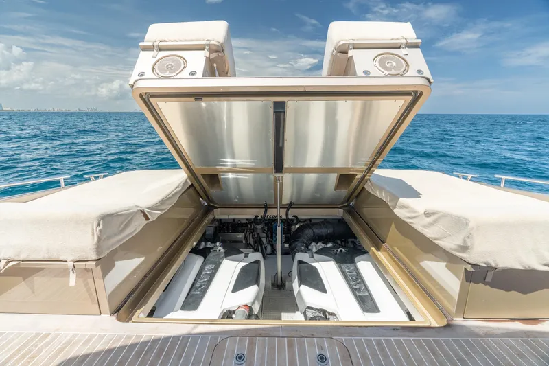 Slide: The Image of 2019 CNM Continental 54 yacht engine compartment open, revealing dual engines at sea. - 41