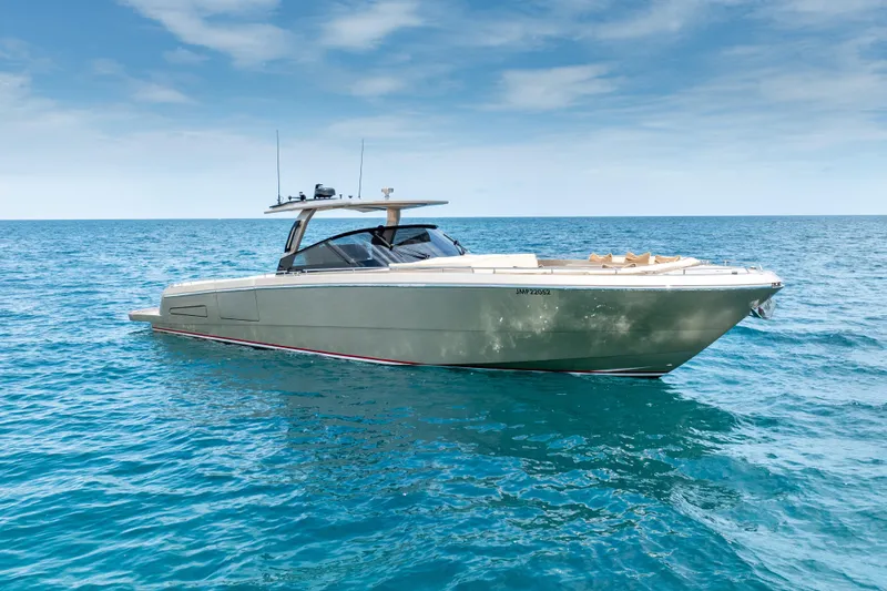 Slide: The Image of Luxurious 2019 CNM Continental 54 yacht cruising on clear blue ocean waters. - 9