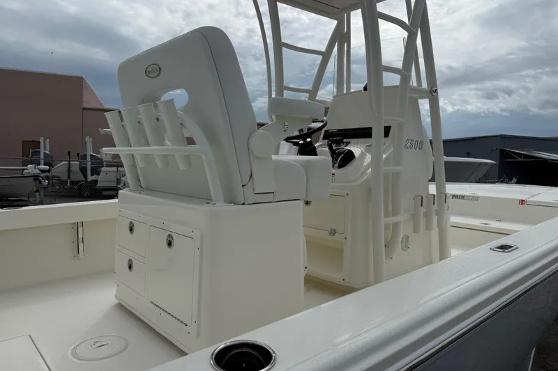 Slide: The Image of 2026 Pathfinder 2500 Hybrid boat interior with seating and control console. - 6