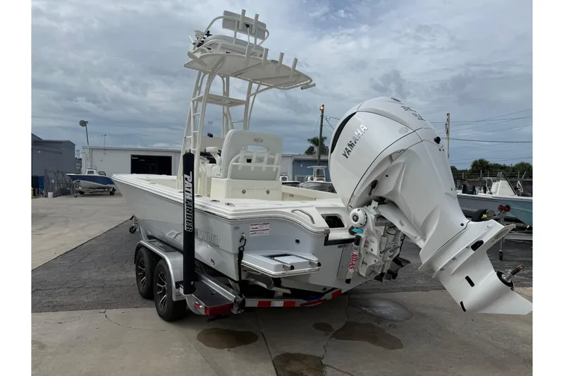 Slide: The Image of 2026 Pathfinder 2500 Hybrid boat with Yamaha outboard motor on a trailer. - 9