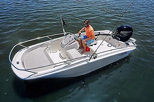 The Image of 2026 Boston Whaler 130 Super Sport boat on water with person fishing. - 0