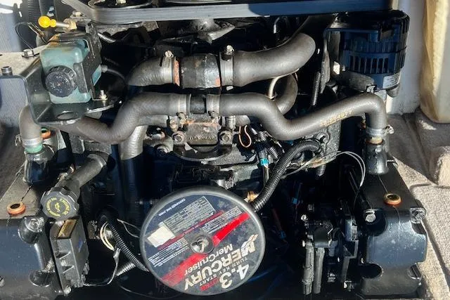 Slide: The Image of Engine of a 2005 Sea Ray 185 Sport boat, featuring a 4.3L Mercury motor. - 13
