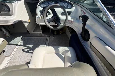 Slide: The Image of Interior view of 2005 Sea Ray 185 Sport boat cockpit with steering wheel and controls. - 3