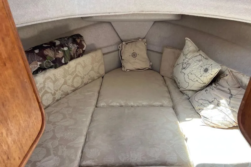 Slide: The Image of Cozy cabin interior of 2007 Ranger Tugs R-25 with patterned cushions and pillows. - 7