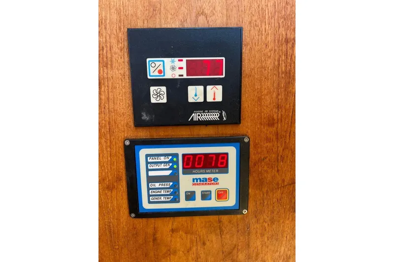 Slide: The Image of Control panel of a 2007 Ranger Tugs R-25 boat with digital displays. - 9