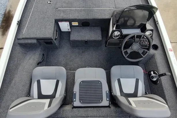 Slide: The Image of 2026 Lowe Stinger 175C boat interior with dual seats and steering console. - 10