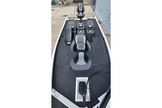Slide: The Image of 2026 Lowe Stinger 175C boat interior with seating and storage compartments. - 3
