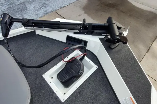 Slide: The Image of 2026 Lowe Stinger 175C boat with Minn Kota trolling motor on deck. - 4