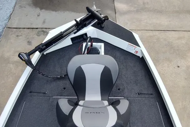 Slide: The Image of 2026 Lowe Stinger 175C boat interior with seat and trolling motor. - 6