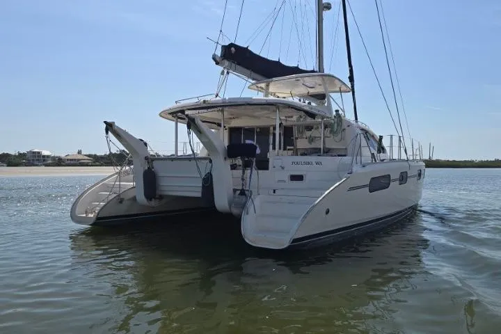 The Image of 2011 Robertson & Caine Leopard 46 catamaran on calm water, rear view. - 0