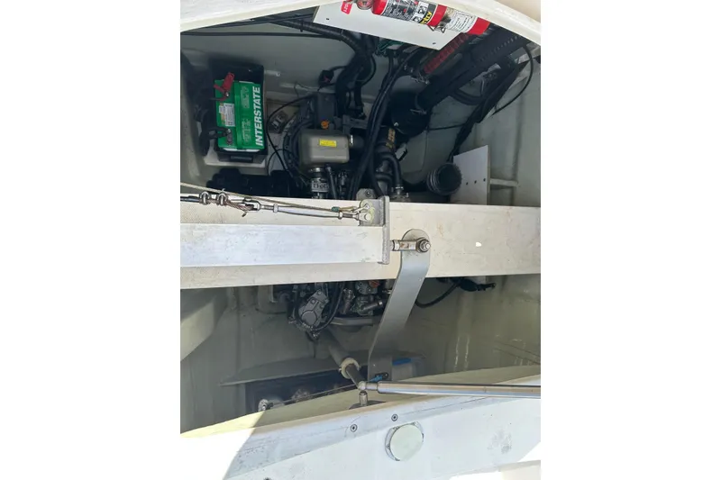 Slide: The Image of Engine compartment of a 2011 Robertson & Caine Leopard 46 catamaran, featuring battery and fire extinguisher. - 15