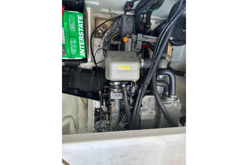 Slide: The Image of Engine compartment of a 2011 Robertson & Caine Leopard 46 catamaran with visible battery. - 16