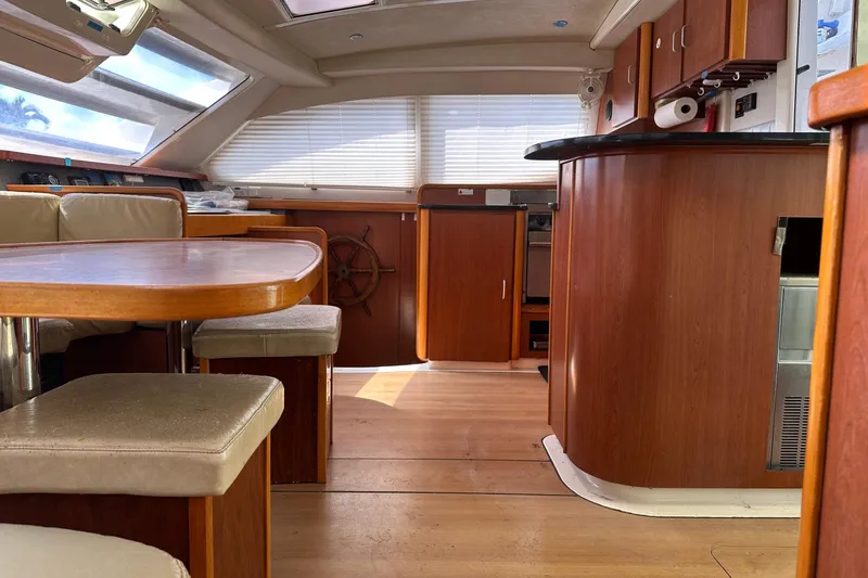 Slide: The Image of Interior of 2011 Robertson & Caine Leopard 46 yacht with wooden furnishings and seating area. - 17