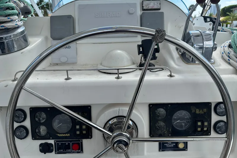 Slide: The Image of Steering wheel and controls of a 2011 Robertson & Caine Leopard 46 yacht. - 19