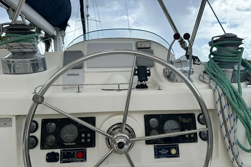 Slide: The Image of Steering wheel and controls of a 2011 Robertson & Caine Leopard 46 catamaran. - 2