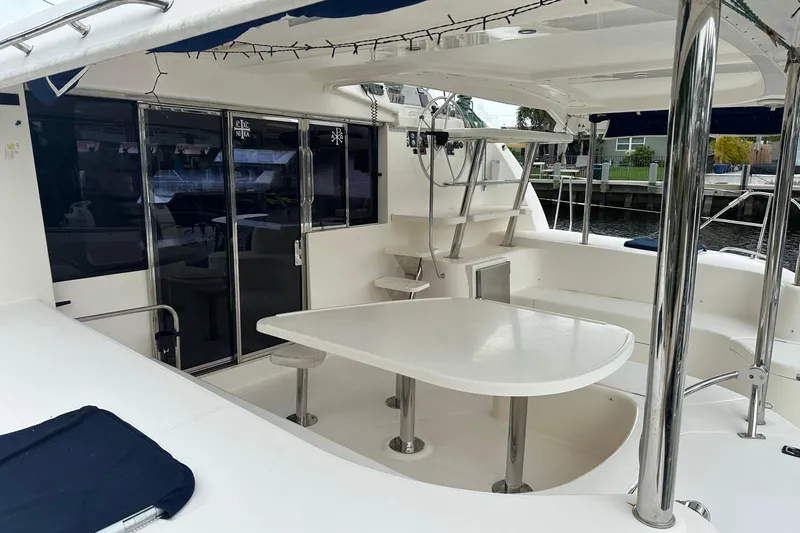 Slide: The Image of Spacious deck of 2011 Robertson & Caine Leopard 46 catamaran with seating and table. - 23