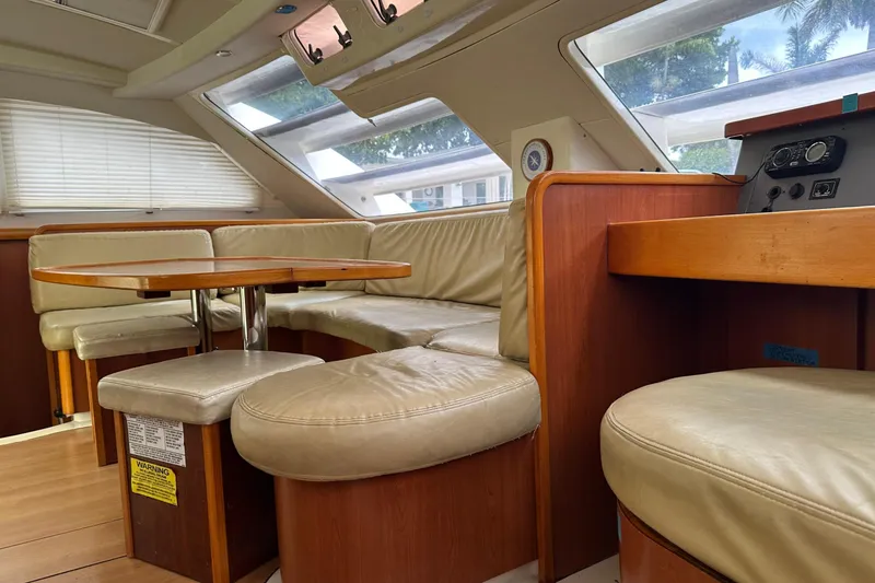 Slide: The Image of Interior of 2011 Robertson & Caine Leopard 46 yacht with leather seating and wooden table. - 27