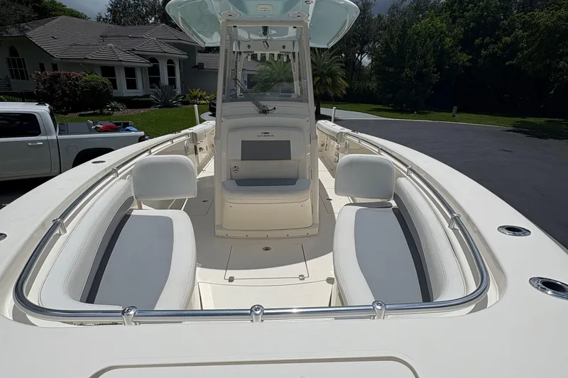 Slide: The Image of 2018 Cobia 301 Center Console boat with spacious seating and sleek design. - 26
