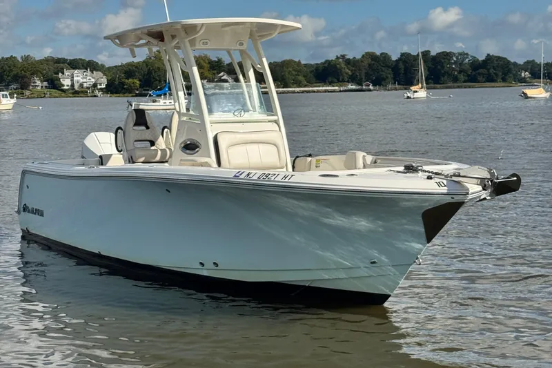 The Image of 2024 Sailfish 241 CC boat on calm water, showcasing sleek design and modern features. - 0