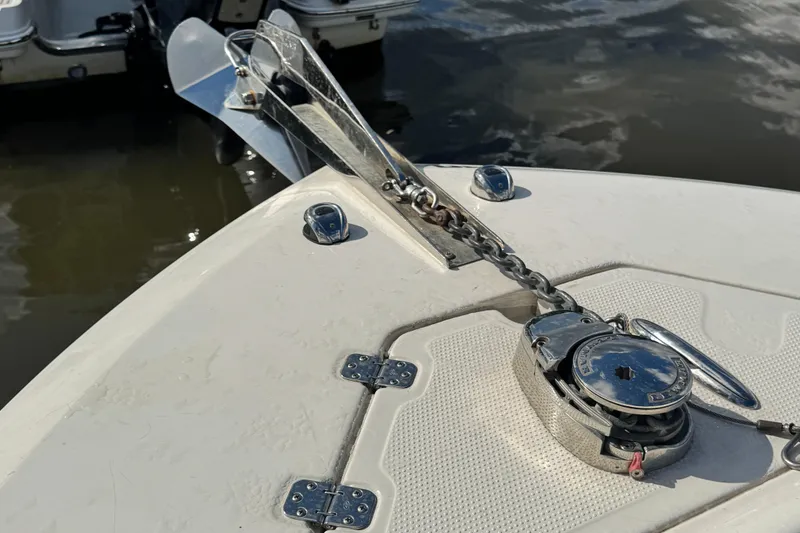 Slide: The Image of 2024 Sailfish 241 CC boat anchor and chain mechanism on deck. - 14