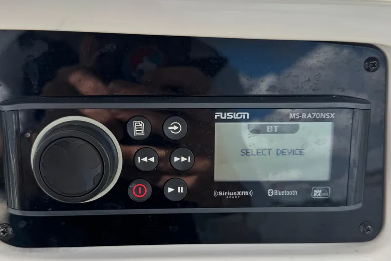 Slide: The Image of Fusion MS-RA70NSX marine stereo on 2024 Sailfish 241 CC, displaying "Select Device." - 22