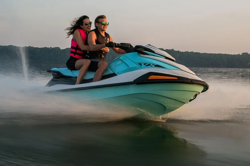 Slide: The Image of Manufacturer Provided Image: Couple enjoying a ride on a 2026 Yamaha WaveRunner VX jet ski on a lake. - 2