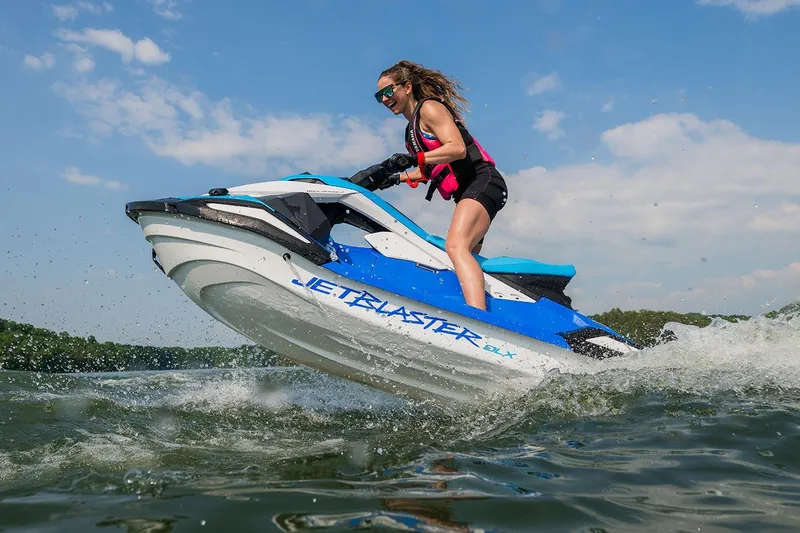 Slide: The Image of Manufacturer Provided Image: 2026 Yamaha WaveRunner JetBlaster DLX 3-Up on water, rider enjoying high-speed adventure. - 2