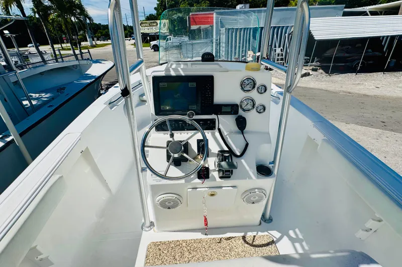 Slide: The Image of 2007 Sea Fox 236 CC boat cockpit with steering wheel and navigation instruments. - 5