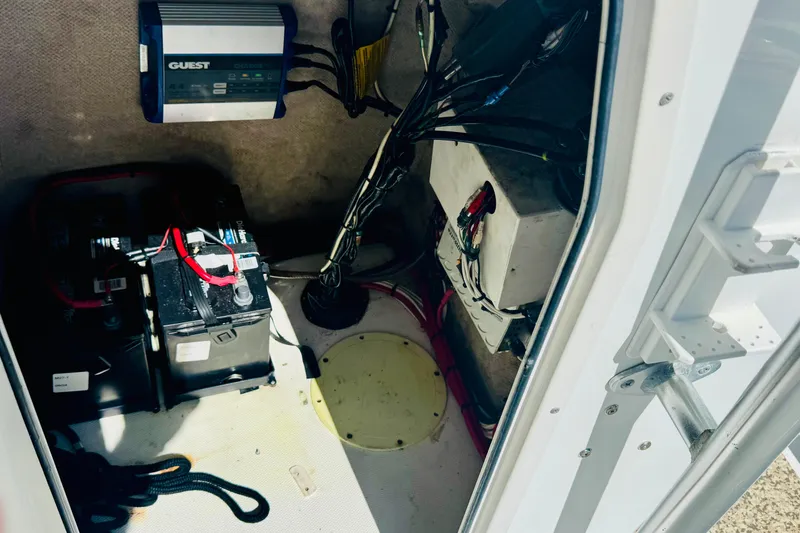 Slide: The Image of Electrical compartment of a 2007 Sea Fox 236 CC boat with batteries and wiring. - 7