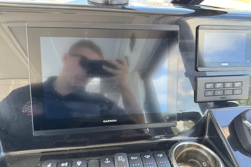 Slide: The Image of Control panel of 2026 Jeanneau NC 895 Series 2 with Garmin and Yamaha displays. - 13