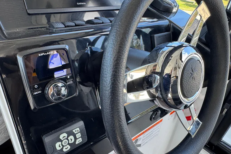 Slide: The Image of Steering wheel and controls of 2026 Jeanneau NC 895 Series 2 boat. - 14