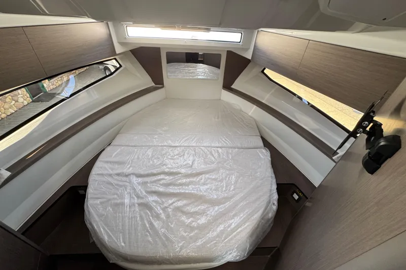 Slide: The Image of Interior cabin of 2026 Jeanneau NC 895 Series 2, featuring a cozy bed and modern design. - 23