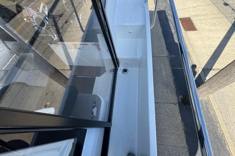 Slide: The Image of 2026 Jeanneau NC 895 Series 2 boat deck with railing and glass window. - 34