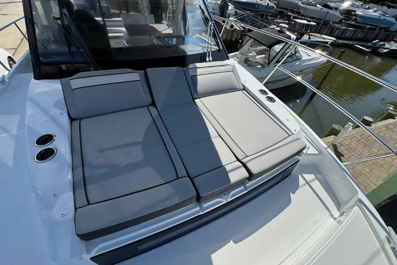 Slide: The Image of 2026 Jeanneau NC 895 Series 2 boat with cushioned sun deck, docked at marina. - 39