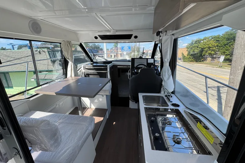 Slide: The Image of Interior of 2026 Jeanneau NC 895 Series 2 boat with kitchen and seating area. - 6