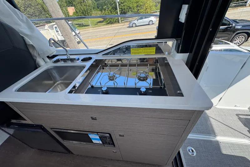 Slide: The Image of 2026 Jeanneau NC 895 Series 2 boat kitchen with stove and sink. - 7