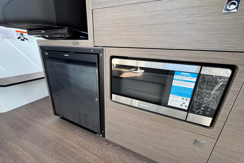 Slide: The Image of Modern kitchen appliances in 2026 Jeanneau NC 895 Series 2 boat interior. - 8