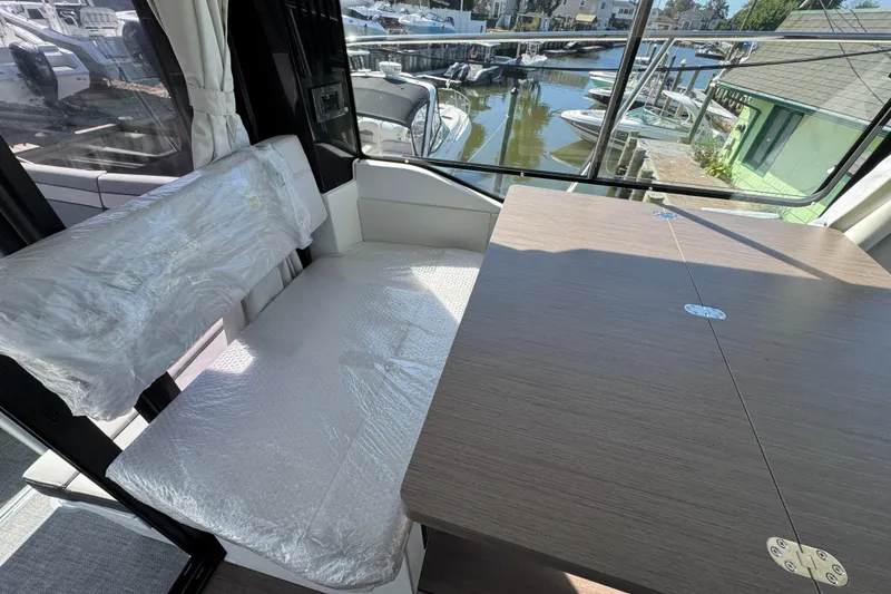 Slide: The Image of Interior of 2026 Jeanneau NC 895 Series 2 boat with seating and table. - 9