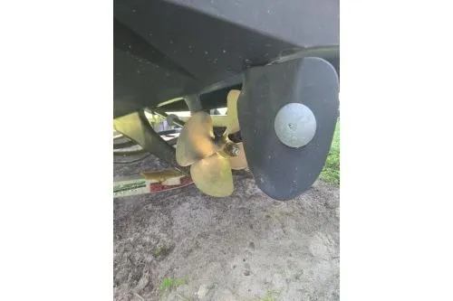 Slide: The Image of 1989 Shamrock 200 Cuddy boat propeller and rudder detail. - 3