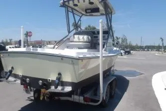 Slide: The Image of 1989 Shamrock 200 Cuddy boat on trailer in sunny parking lot. - 4