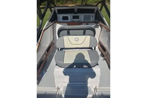Slide: The Image of 1989 Shamrock 200 Cuddy interior with seating and dashboard, featuring classic design elements. - 7